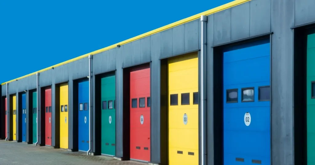 A row of garage doors in different colors, illustrating a choice between fintech SEO agencies