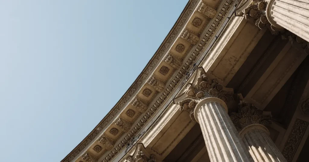 Classical stone columns against a blue sky, for a guide on SEO for fintech
