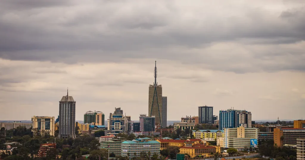 Nairobi city skyline of office towers under heavy grey clouds