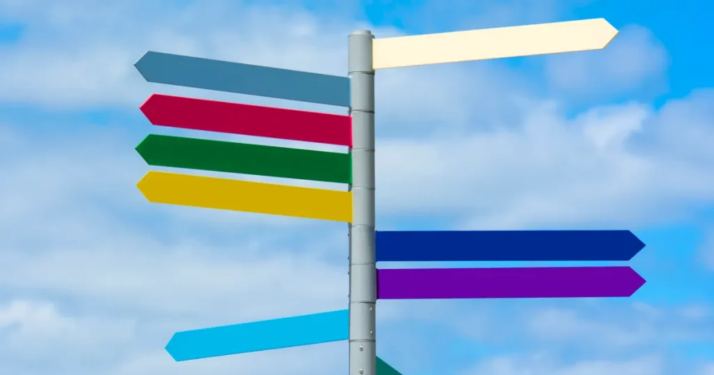 Blank multicoloured direction signs on one pole, a SaaS go-to-market strategy choosing its first channel
